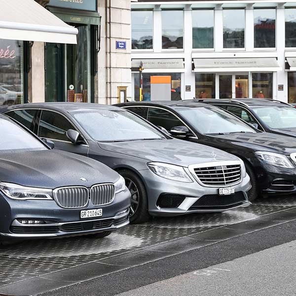 A group of luxury cars in a row